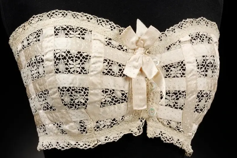 1910 lace ‘bust improver’ corset by Dickins and Jones, from the "Undressed" exhibition at the Victoria and Albert Museum.